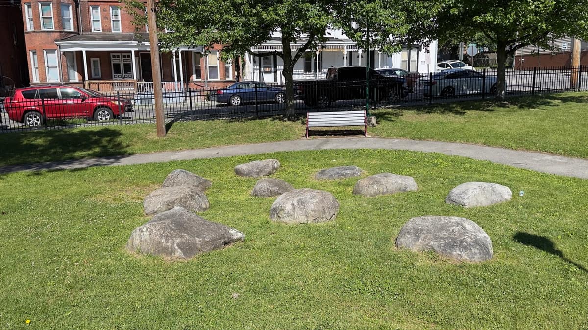 A loose ring of large boulders set into the lawn at Audrey Carey Park.