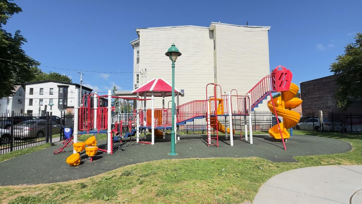 The main play structure at Xavier Lunan Park, with a street lamp behind.