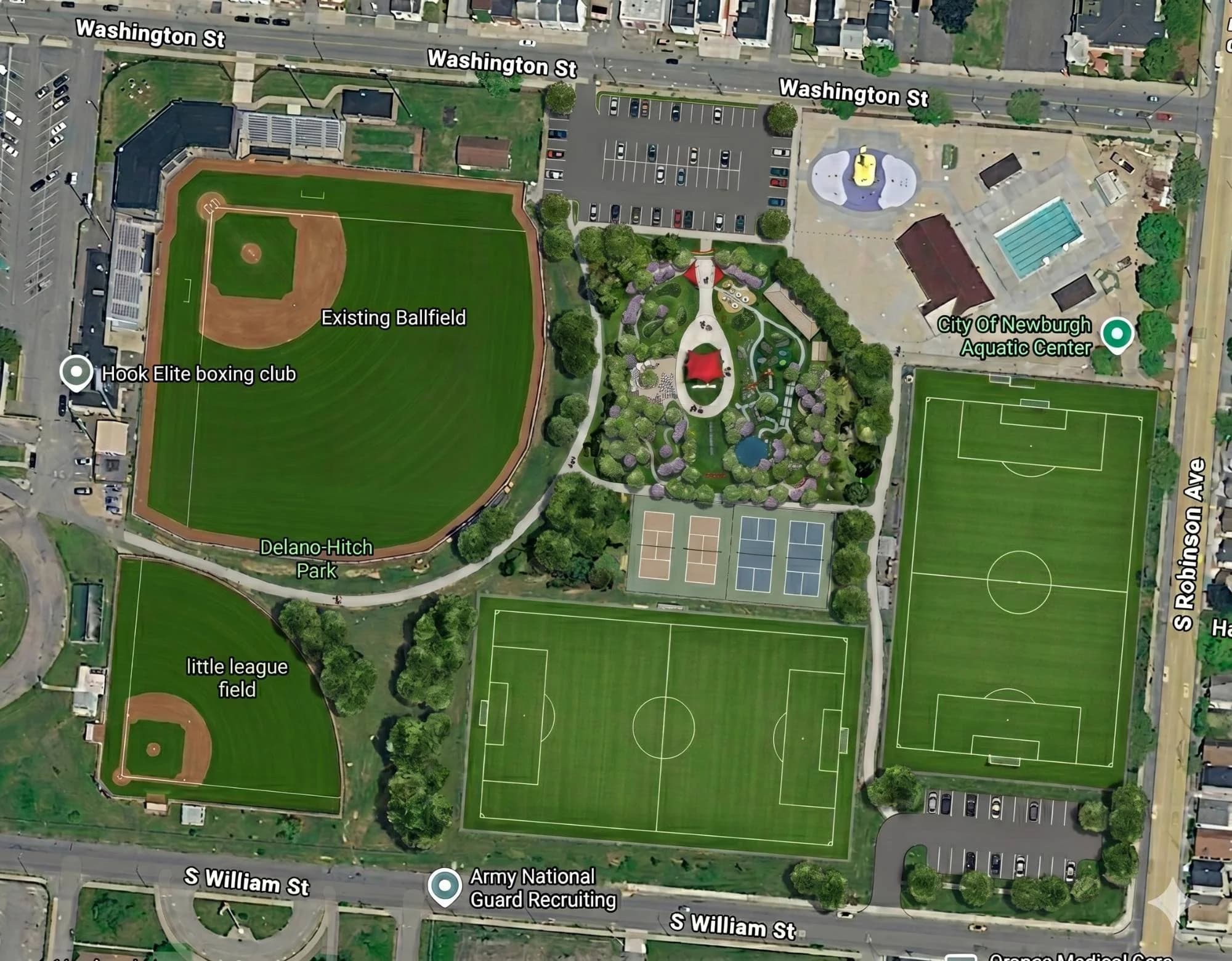 Aerial study of Delano-Hitch Park showing the proposed inclusive playground in context with the rest of the park: existing ballfield, little league field, Aquatic Center, and room set aside for a regulation soccer field, additional courts, and parking.