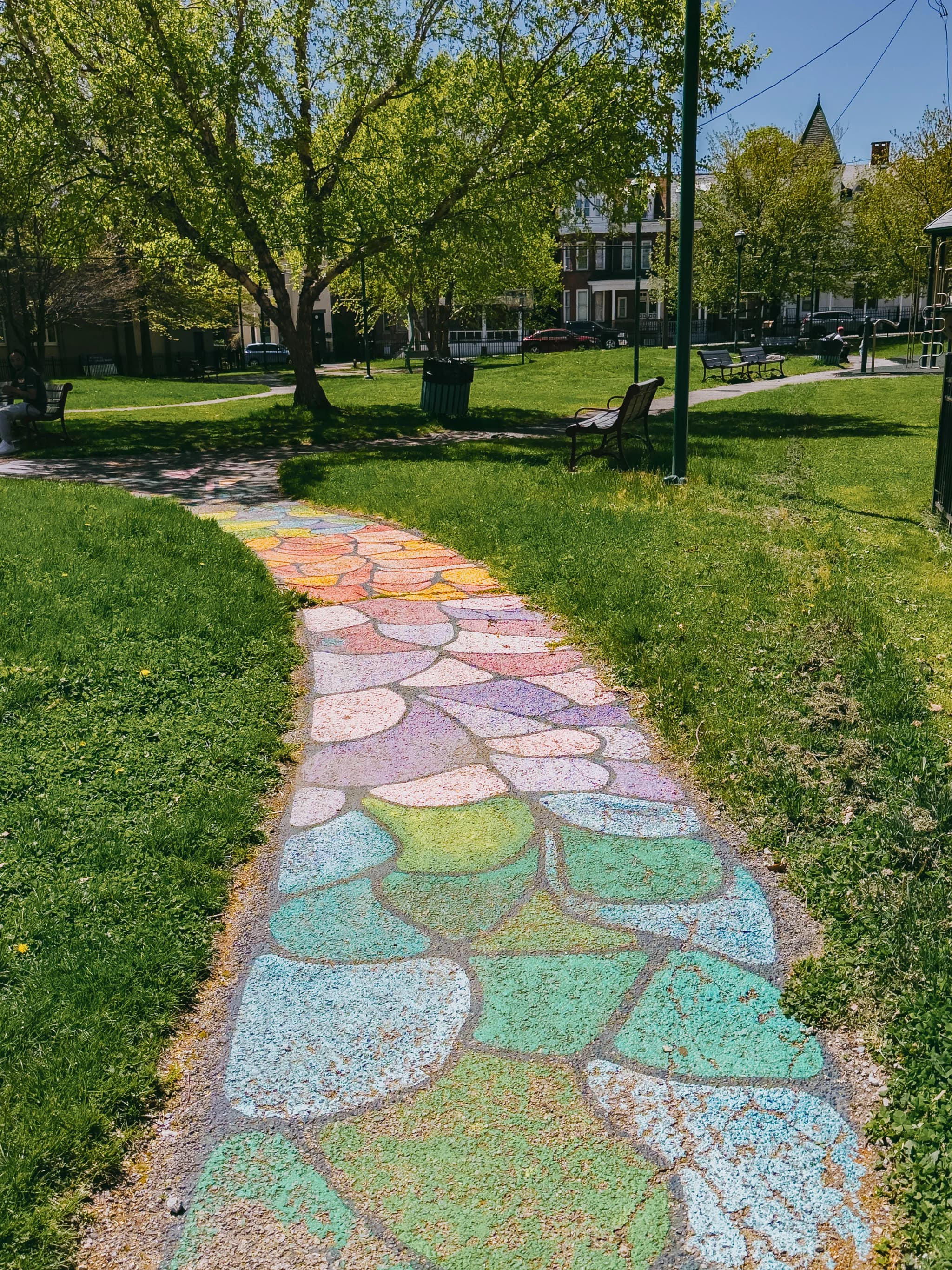 A colorful mosaic path winding through Audrey Carey Park.